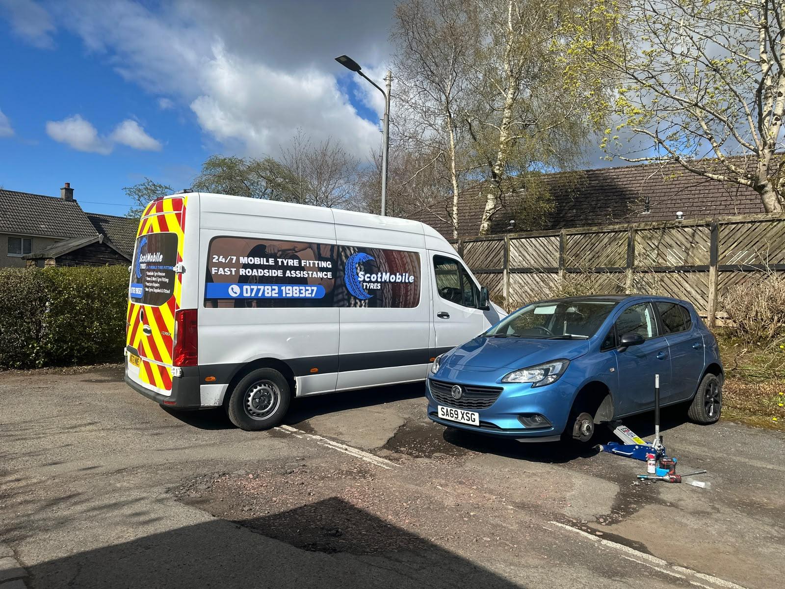Scot Mobile Tyres van beside a vehicle receiving mobile tyre assistance