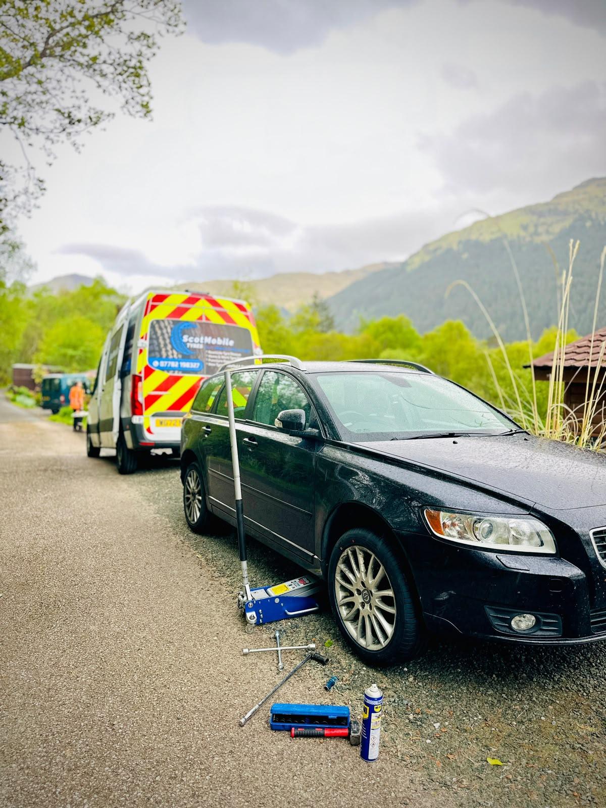 Scot Mobile Tyres van attending a roadside tyre replacement in the Highlands